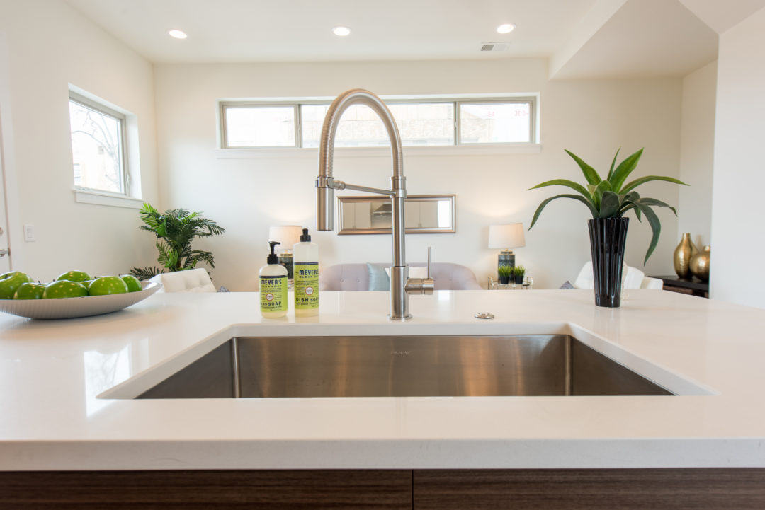 sustainable design build denver colorado west colfax 1220 perry stainless steel sink basin delta kitchen faucet quartz counter
