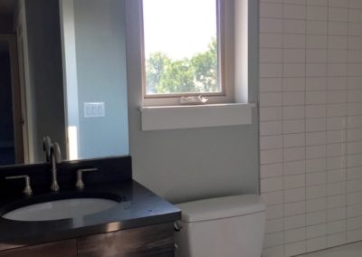 sustainable design build denver colorado west colfax 1275 xavier bathroom custom tile subway quartz vanity