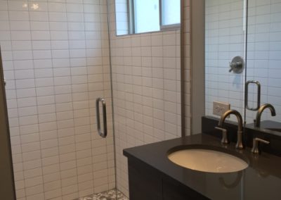 sustainable design build denver colorado west colfax 1275 xavier bathroom custom shower tile pan glass door subway mosaic quartz vanity