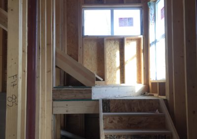 sustainable design build denver colorado west colfax 1254 perry during construction window install stair landing structural steel column