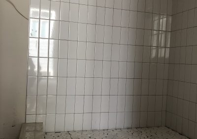 sustainable design build denver colorado west colfax 1265 xavier custom shower pan tile mosaic during construction