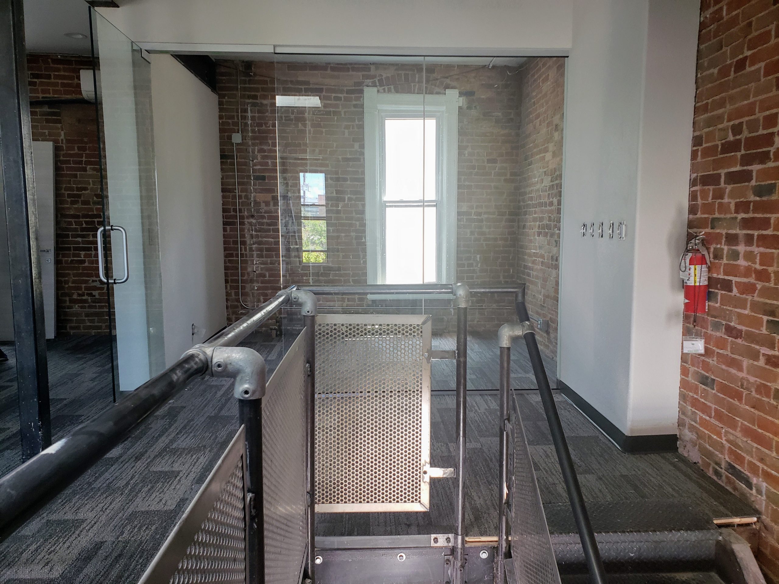 Summit Church Office stairs iron steel railing glass walls stairwell 