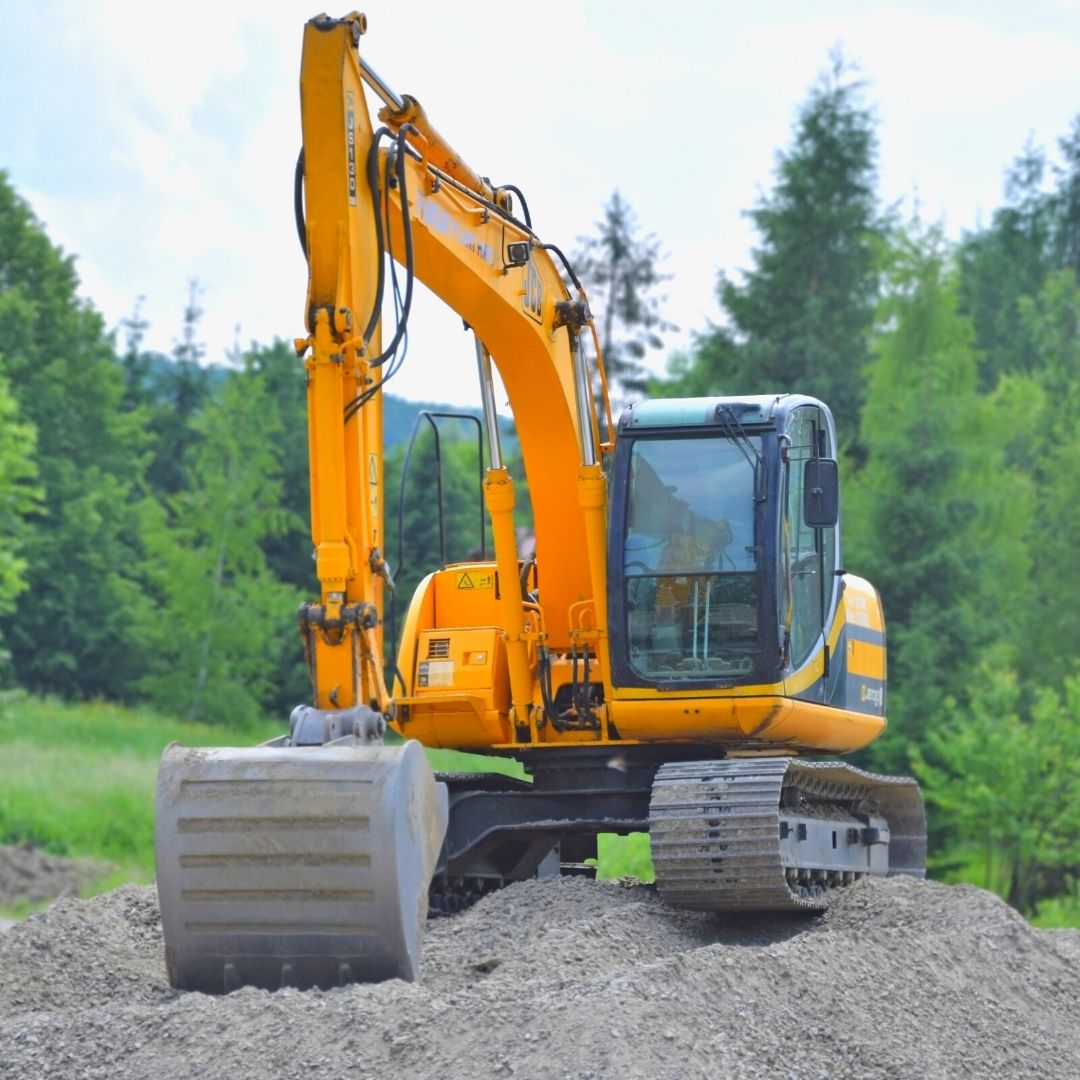 yellow dragon construction machine trees gravel dirt building adu