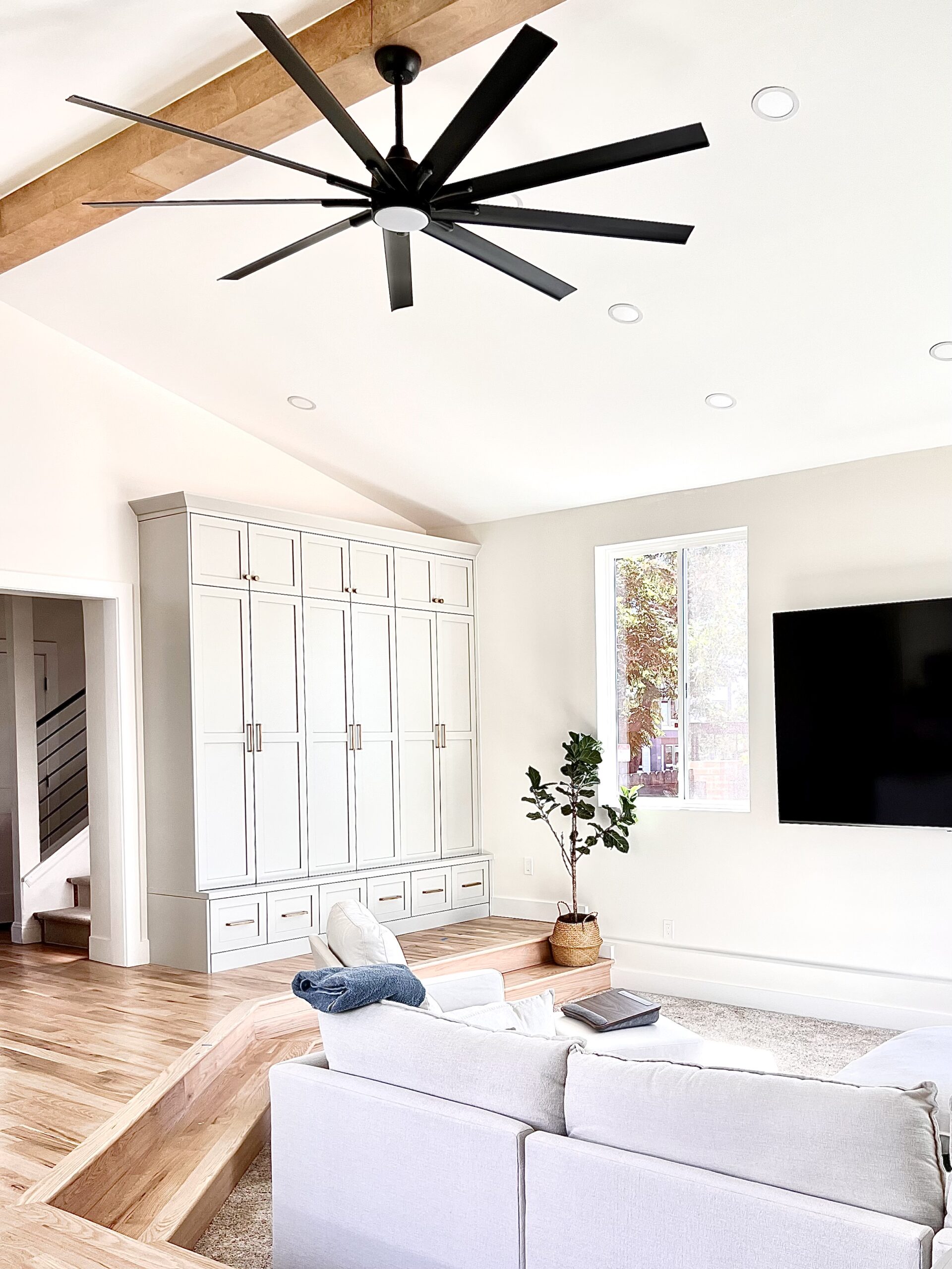 Denver Home Addition with built-in custom cabinetry newly built living room space with built-in custom cabinetry recessed conversation pit family room