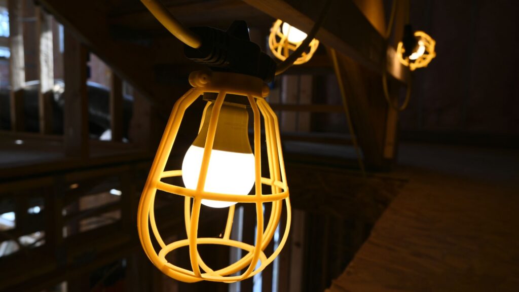 Wheat Ridge ADU construction with temporary lighting strung about a wood framing of a structure by Sustainable Design Build