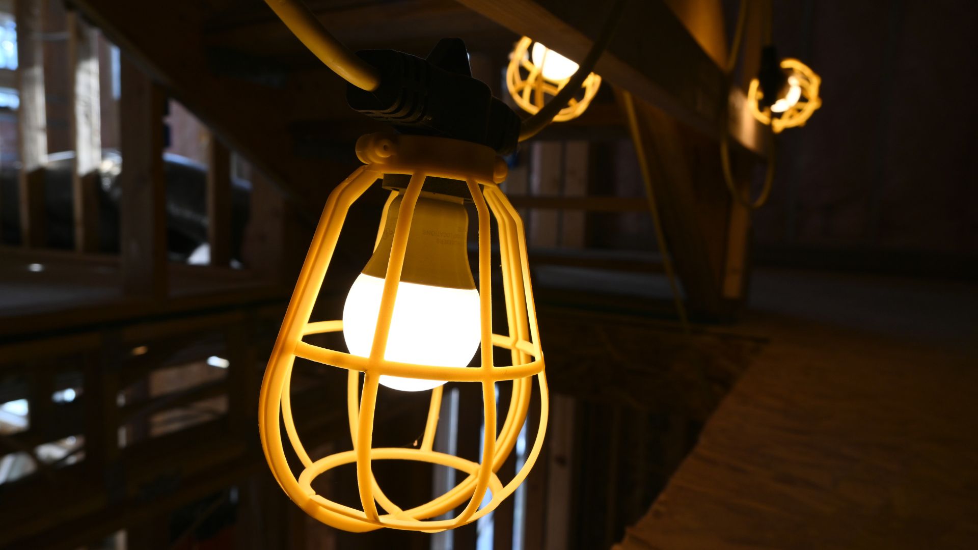 How to Prepare for Your ADU Project in Wheat Ridge Wheat Ridge ADU construction with temporary lighting strung about a wood framing of a structure by Sustainable Design Build