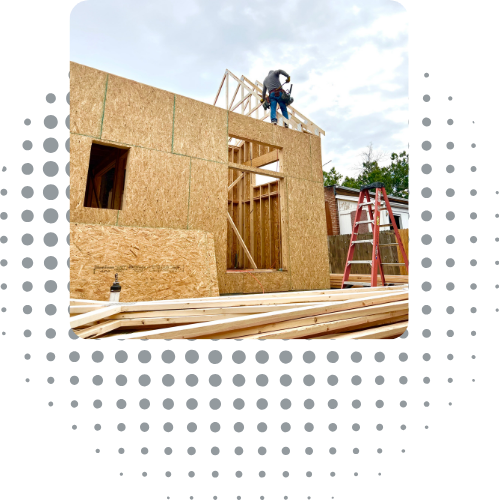 Sustainable Design Build employees and contractors working on a framing project for a home addition