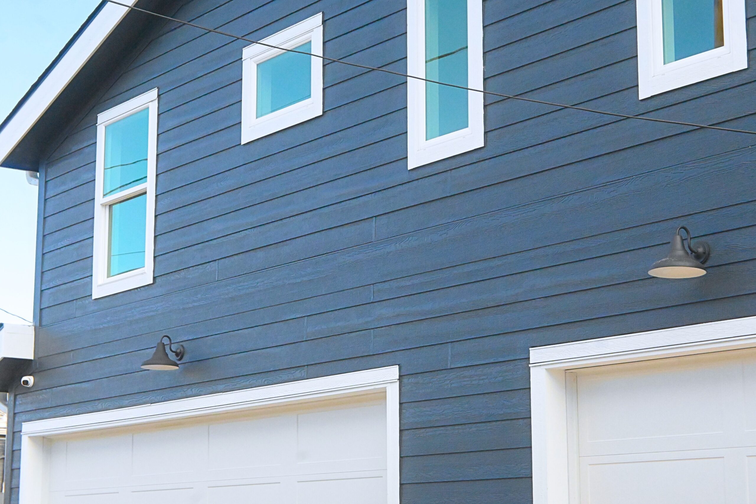 littleton home remodels custom cabinet blue grey lowers with brass and gold hardware supporting white quartz like countertop in newly remodeled kitchen