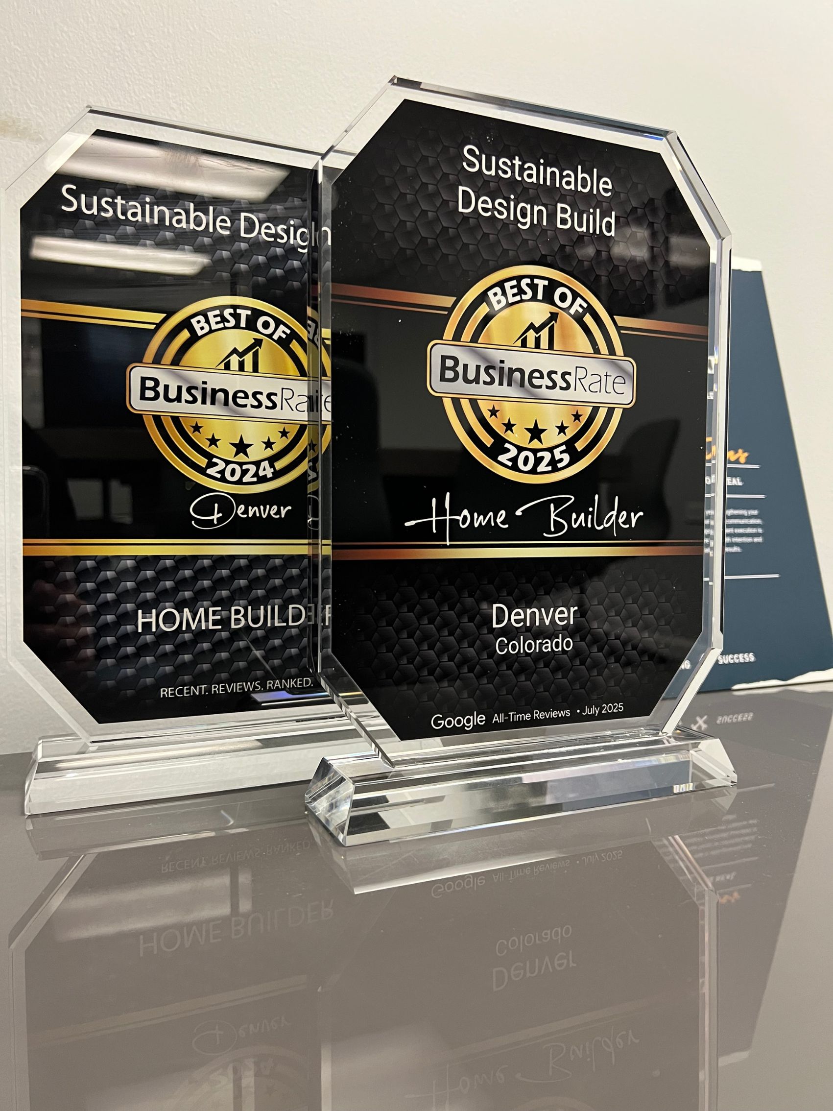 littleton home remodels custom cabinet blue grey lowers with brass and gold hardware supporting white quartz like countertop in newly remodeled kitchen