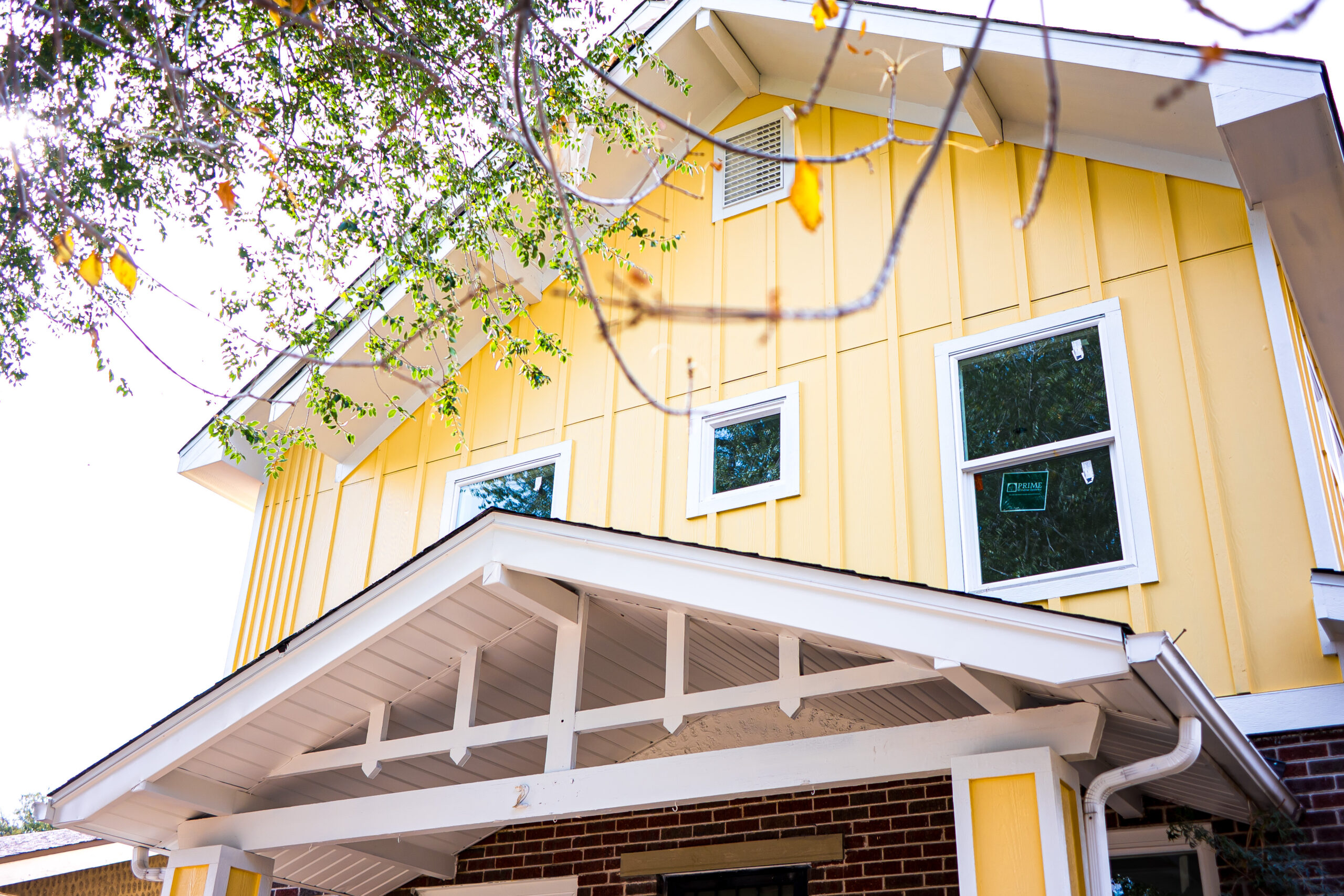 home addition pop top denver sustainable design build yellow exterior