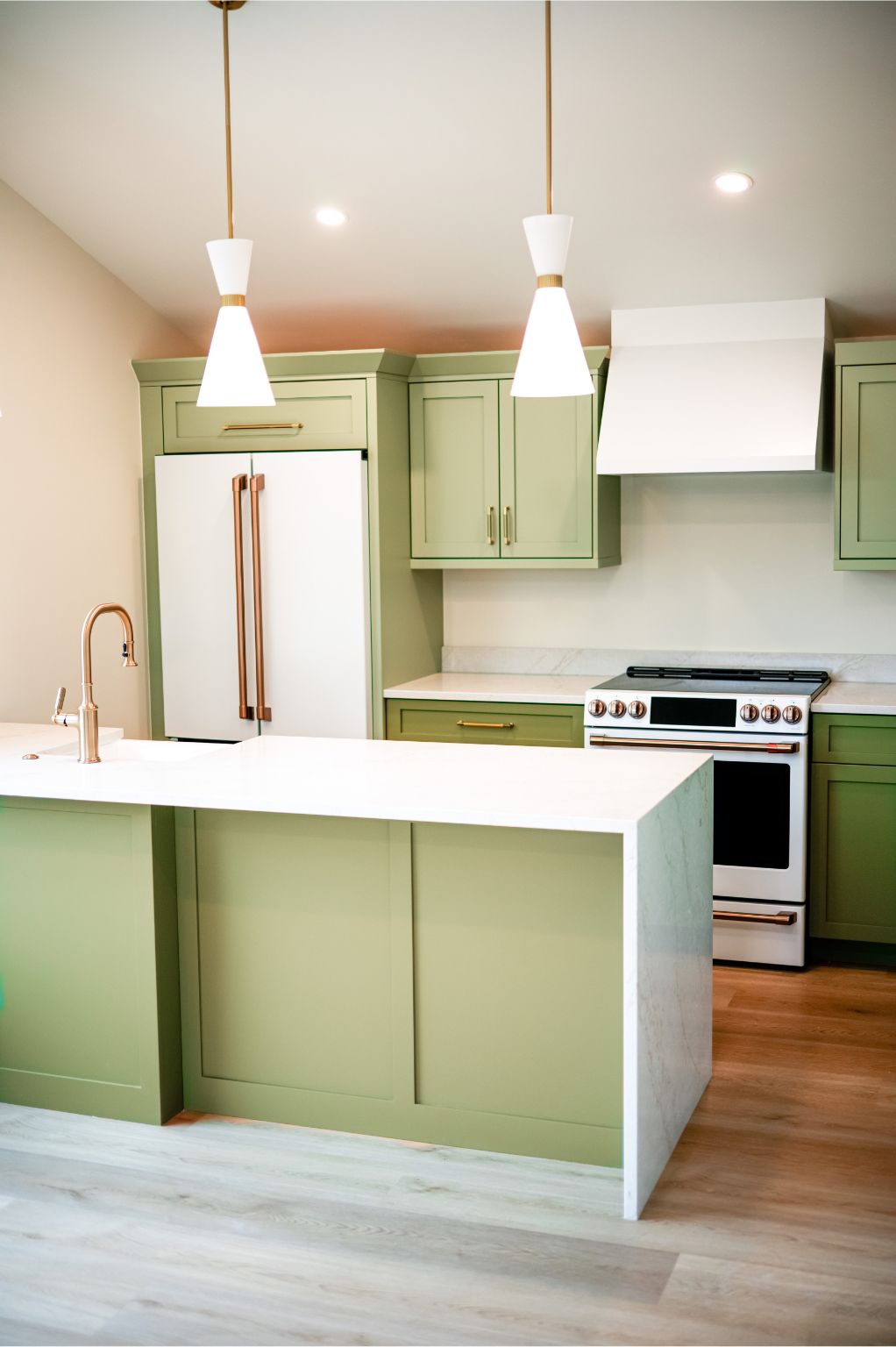 ADU kitchen denver family relatives green cabinets overhead lights white walls new appliances